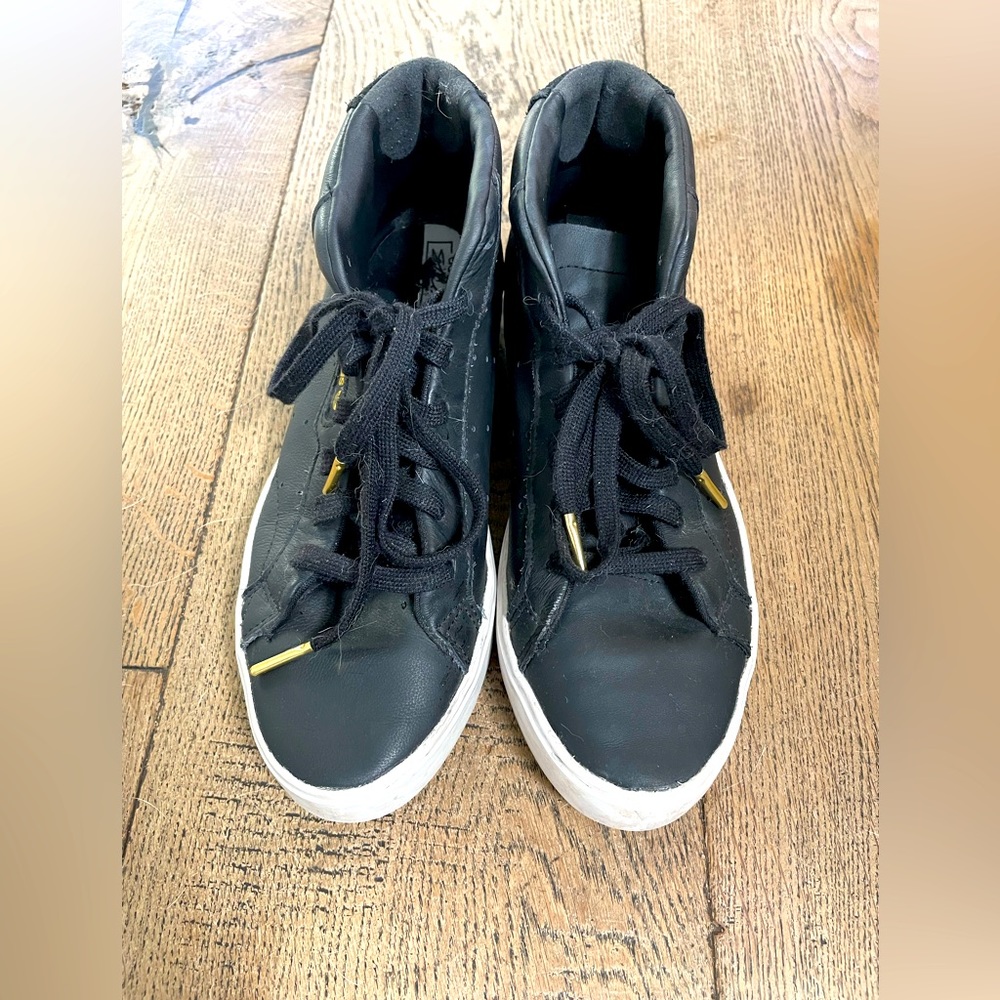 Adidas mid-high top.  Barely ever worn.